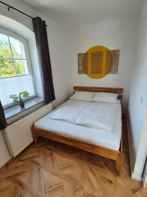 Ein Bett oder Betten in einem Zimmer der Unterkunft 2-Zimmer Wohnung 3 - Apartments am Schloss