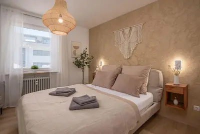 Ein Bett oder Betten in einem Zimmer der Unterkunft MY STAY - Erholung am Chiemsee in zentraler Lage in Prien