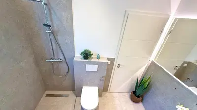 Ein Badezimmer in der Unterkunft BeckHomes Munich - Stylish Central Apartments