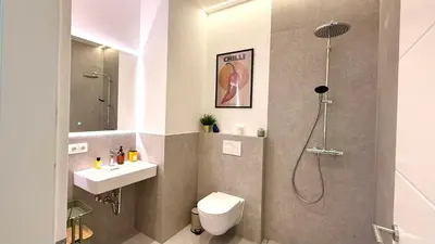 Ein Badezimmer in der Unterkunft BeckHomes Munich - Stylish Central Apartments