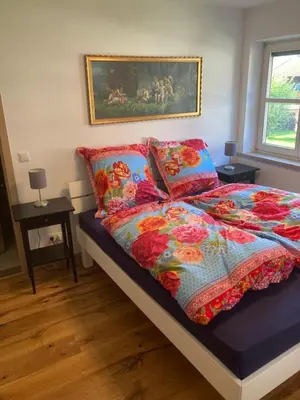 Ein Bett oder Betten in einem Zimmer der Unterkunft Ferienwohnung in der Au