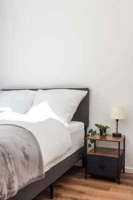 Ein Bett oder Betten in einem Zimmer der Unterkunft Central Apartments Direkt am Königsplatz l Fußball-Tisch I perfekt für Familien & Freunde & Business