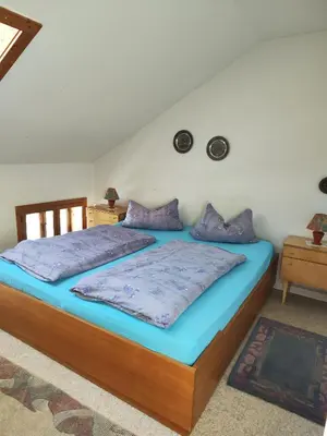 Ein Bett oder Betten in einem Zimmer der Unterkunft Hintergraber Hof