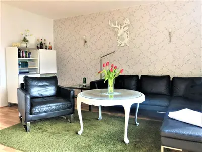 Ein Sitzbereich in der Unterkunft Apartment Sir George