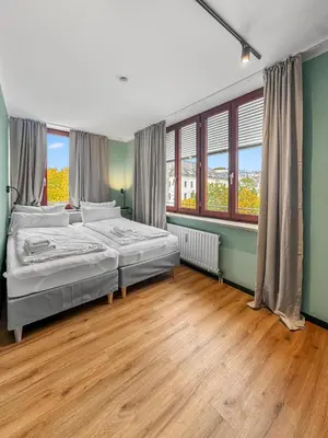 Ein Bett oder Betten in einem Zimmer der Unterkunft Flatista Homes - Herzog Heinrich