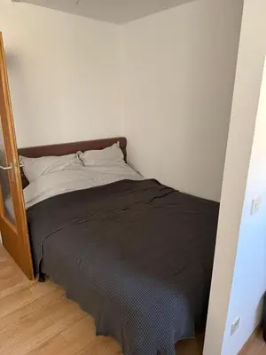Ein Bett oder Betten in einem Zimmer der Unterkunft Apartment Schwabing Balkon und Garage inklusive