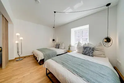 Ein Bett oder Betten in einem Zimmer der Unterkunft Lexapartments zentral 101qm in Altstadtnähe