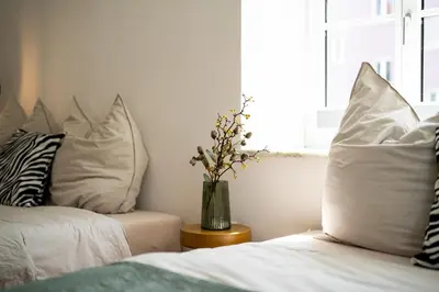 Ein Bett oder Betten in einem Zimmer der Unterkunft Lexapartments zentral 101qm in Altstadtnähe