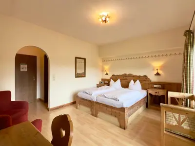 Ein Bett oder Betten in einem Zimmer der Unterkunft Hotel Forsthaus Oberau