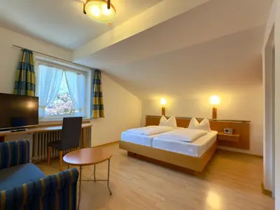 Ein Bett oder Betten in einem Zimmer der Unterkunft Hotel Forsthaus Oberau