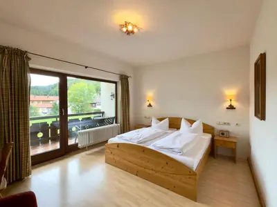 Ein Bett oder Betten in einem Zimmer der Unterkunft Hotel Forsthaus Oberau