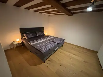Ein Bett oder Betten in einem Zimmer der Unterkunft Jenbachnest
