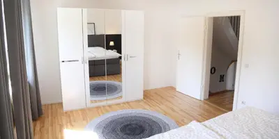 Ein Bett oder Betten in einem Zimmer der Unterkunft Ferienglück Rosenheim