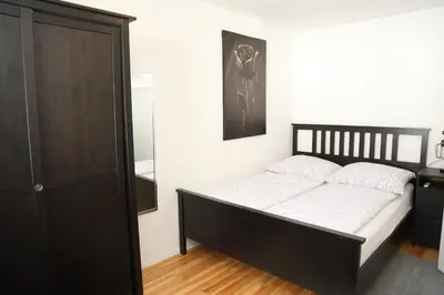 Ein Bett oder Betten in einem Zimmer der Unterkunft Ferienglück Rosenheim