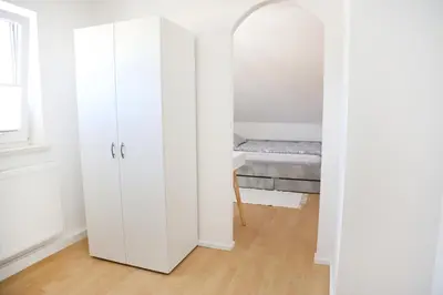 Ein Bett oder Betten in einem Zimmer der Unterkunft Ferienglück Rosenheim
