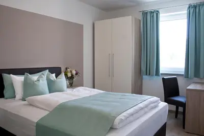 Ein Bett oder Betten in einem Zimmer der Unterkunft Hotel Claro Garni