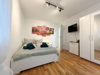 Ein Bett oder Betten in einem Zimmer der Unterkunft AugsburgLiving - Business- und Ferienapartments