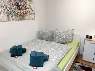 Ein Bett oder Betten in einem Zimmer der Unterkunft AugsburgLiving - Business- und Ferienapartments