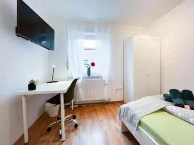 Ein Bett oder Betten in einem Zimmer der Unterkunft AugsburgLiving - Business- und Ferienapartments