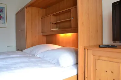 Ein Bett oder Betten in einem Zimmer der Unterkunft Ferienwohnung Alpina 2
