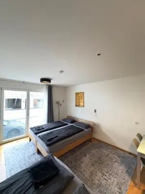 Ein Bett oder Betten in einem Zimmer der Unterkunft Modernes Apartment - Pasing Arcaden - S-Bahn
