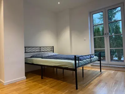 Ein Bett oder Betten in einem Zimmer der Unterkunft Nice and big Apartment for up to 10 people in a very good Location of Munich! Good for Oktoberfest!