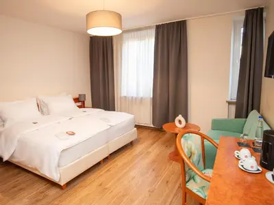 Ein Bett oder Betten in einem Zimmer der Unterkunft Hotel Deutsches Theater Landwehrstraße