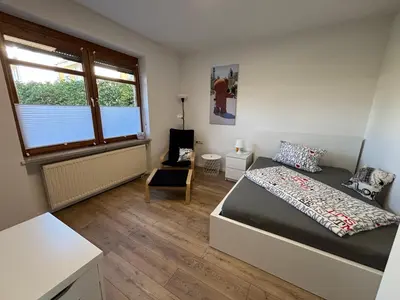 Ein Bett oder Betten in einem Zimmer der Unterkunft Urban Oasis Friedberg