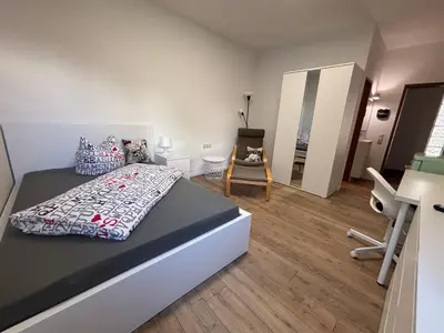 Ein Bett oder Betten in einem Zimmer der Unterkunft Urban Oasis Friedberg