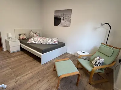 Ein Bett oder Betten in einem Zimmer der Unterkunft Urban Oasis Friedberg