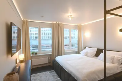 Ein Bett oder Betten in einem Zimmer der Unterkunft Sams Living New York - Munich City