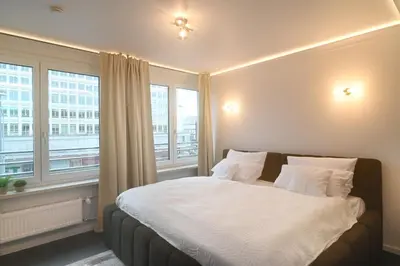 Ein Bett oder Betten in einem Zimmer der Unterkunft Sams Living New York - Munich City