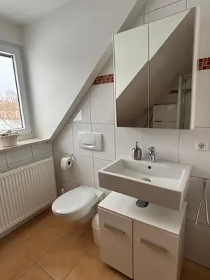 Ein Badezimmer in der Unterkunft Ferienwohnung mit Küche und Bad