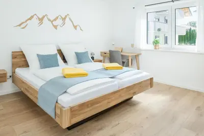 Ein Bett oder Betten in einem Zimmer der Unterkunft Ferienwohnung Mondscheinbauer Übersee am Chiemsee