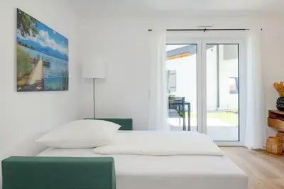 Ein Bett oder Betten in einem Zimmer der Unterkunft Ferienwohnung Mondscheinbauer Übersee am Chiemsee