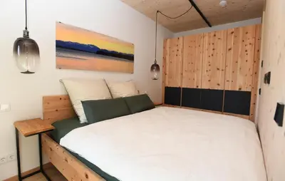 Ein Bett oder Betten in einem Zimmer der Unterkunft Das SeeQuartier - Ein Ort zum Genießen - Luxuriös und BrandNEU