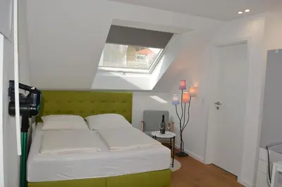 Ein Bett oder Betten in einem Zimmer der Unterkunft Zentral Apartment