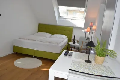 Ein Bett oder Betten in einem Zimmer der Unterkunft Zentral Apartment