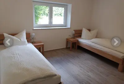 Ein Bett oder Betten in einem Zimmer der Unterkunft Haus für Monteure und Studenten