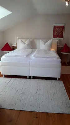Ein Bett oder Betten in einem Zimmer der Unterkunft Ferienhaus Alpenpanorama