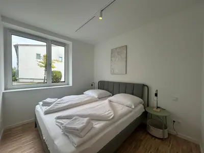 Ein Bett oder Betten in einem Zimmer der Unterkunft GIH Apartments - Neufahrn