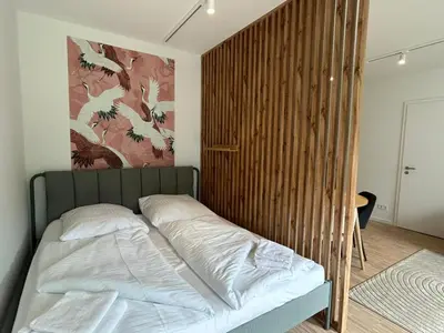 Ein Bett oder Betten in einem Zimmer der Unterkunft GIH Apartments - Neufahrn