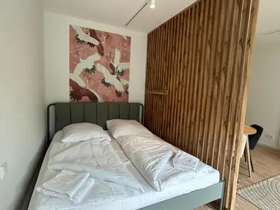 Ein Bett oder Betten in einem Zimmer der Unterkunft GIH Apartments - Neufahrn