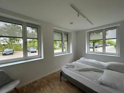 Ein Bett oder Betten in einem Zimmer der Unterkunft GIH Apartments - Neufahrn