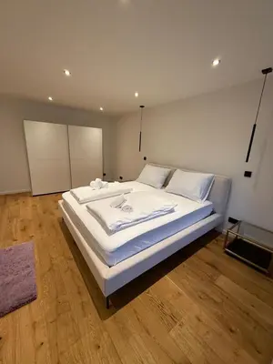 Ein Bett oder Betten in einem Zimmer der Unterkunft Modern apartment with terrace in Solln