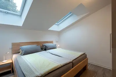 Ein Bett oder Betten in einem Zimmer der Unterkunft Ferienwohnung am Luegsteinsee