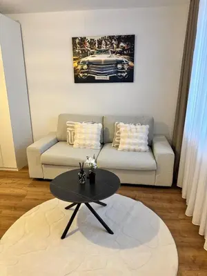 Ein Sitzbereich in der Unterkunft Modern City Apartment 3