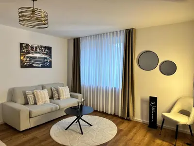 Ein Sitzbereich in der Unterkunft Modern City Apartment 3