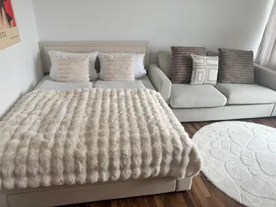 Ein Bett oder Betten in einem Zimmer der Unterkunft Skyline & Frühlingsfest
