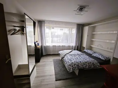 Ein Bett oder Betten in einem Zimmer der Unterkunft Einzimmerappartment München Solln